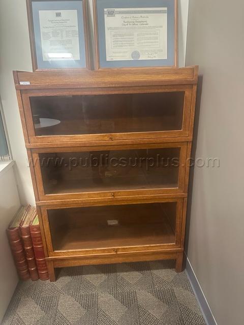Wooden bookcase with glass doors